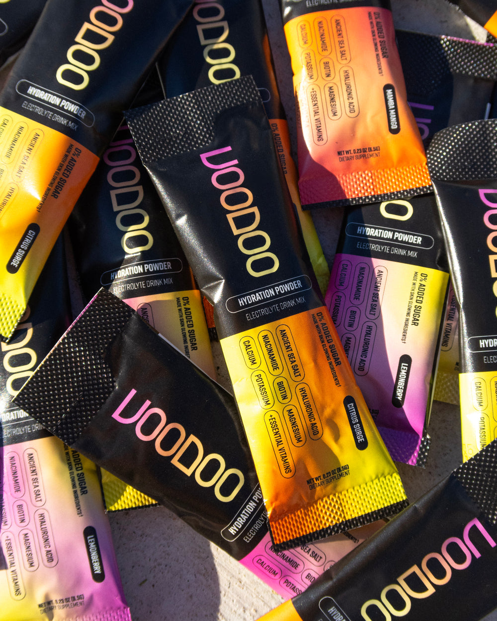 Multiple packets of VooDoo hydration powder in various flavors.